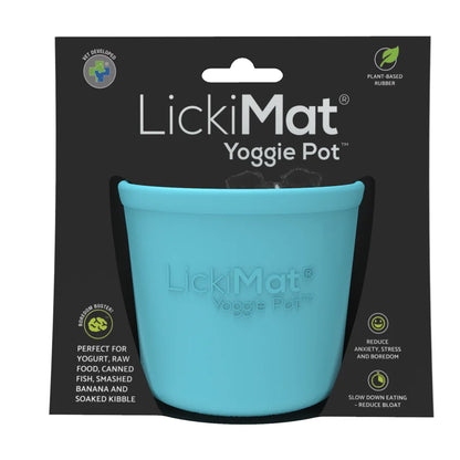 LickiMat Yoggie Pot with food spread on textured surface