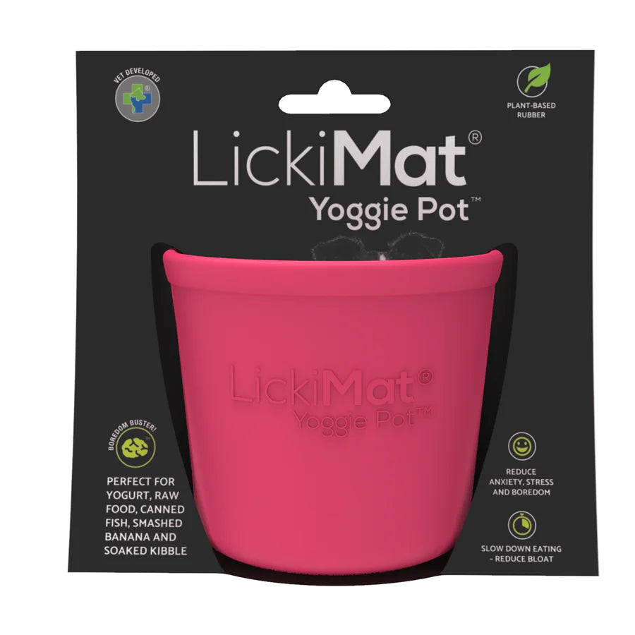 LickiMat Yoggie Pot dog licking food from the bowl