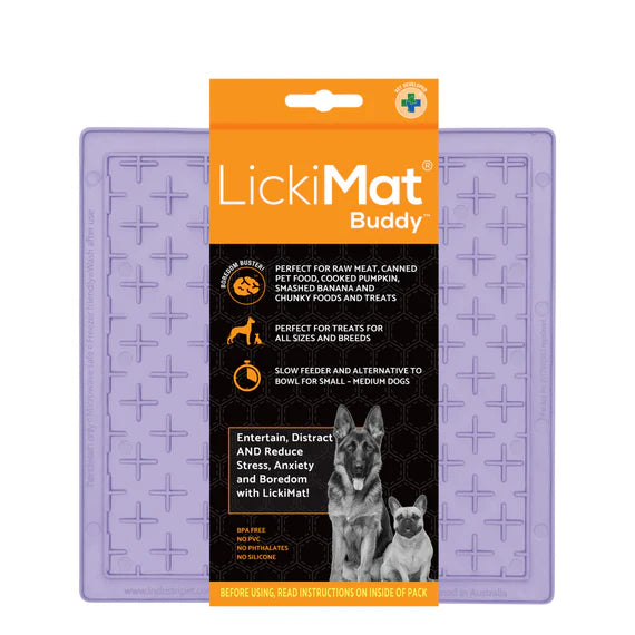 Dog licking treat off a LickiMat Pastel Buddy mat