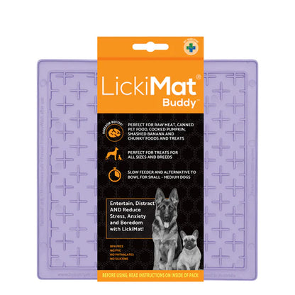 Dog licking treat off a LickiMat Pastel Buddy mat