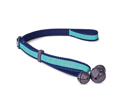 Dog nudging the Coachi Toilet Training Bells
