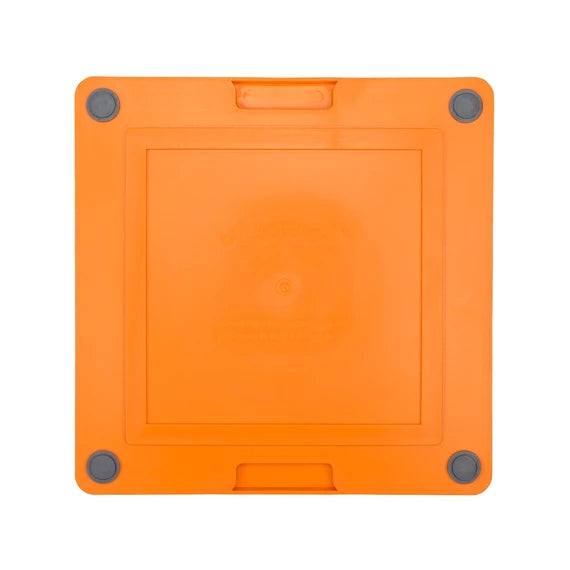 LickiMat Soother Tuff orange mat in use with a dog
