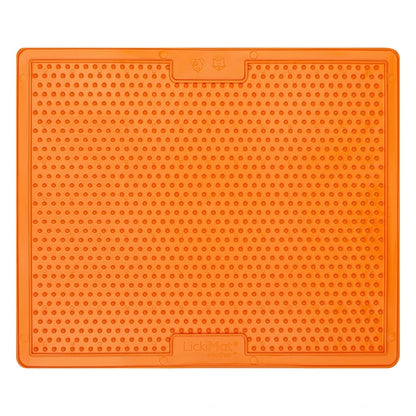 Dog licking LickiMat Soother X Large in orange