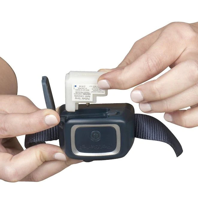Placing a refill cartridge into the PetSafe Spray Bark Collar