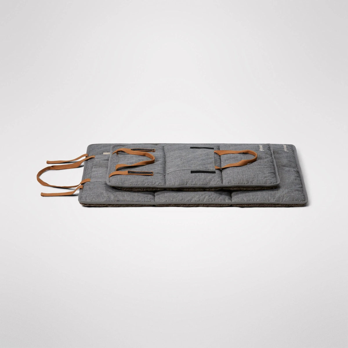Water resistant outer fabric on the reverse of the Travel Swag mat