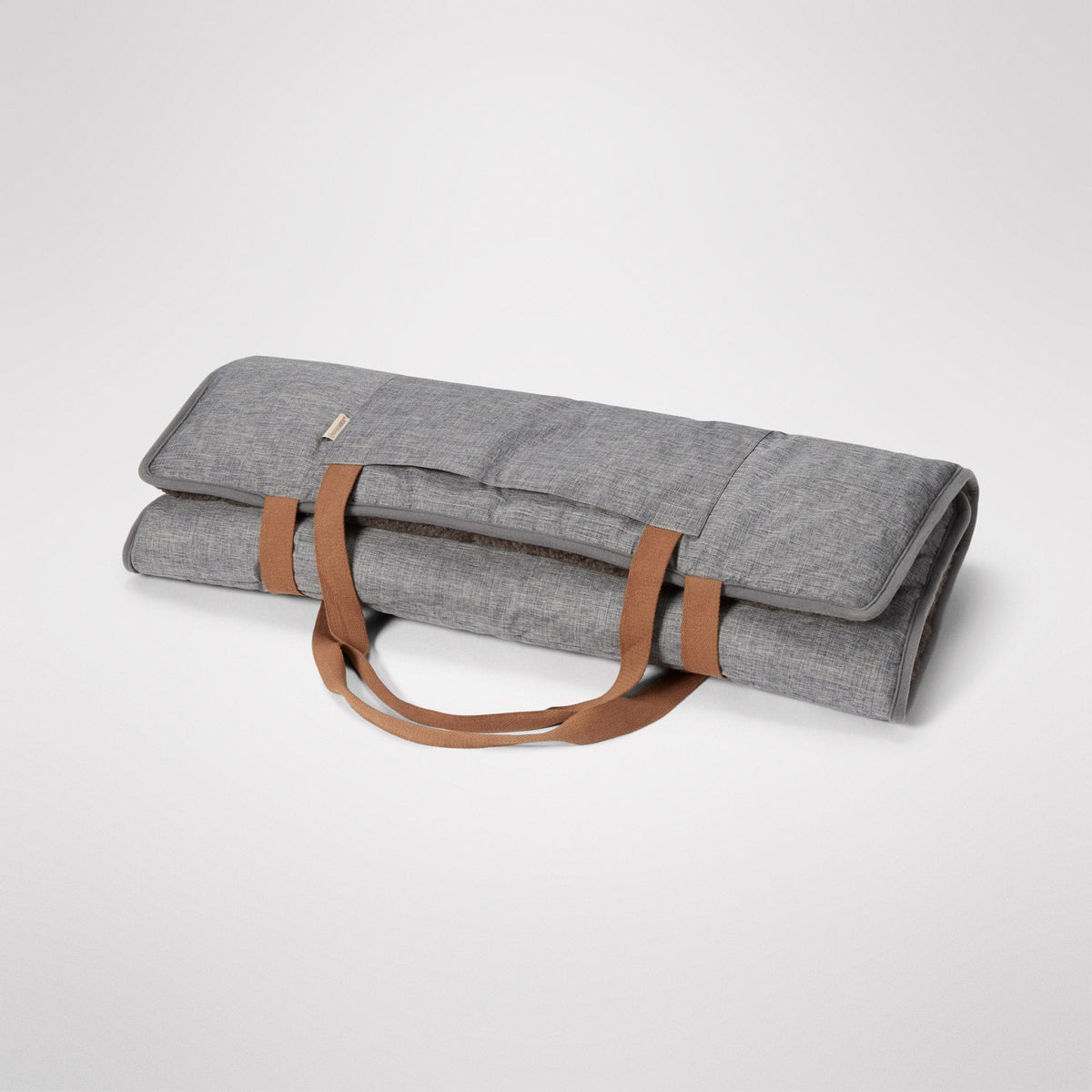 Travel Swag rolled and carried by its handles like a bag