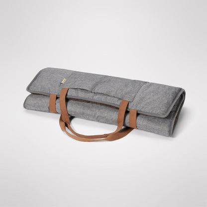 Travel Swag rolled and carried by its handles like a bag